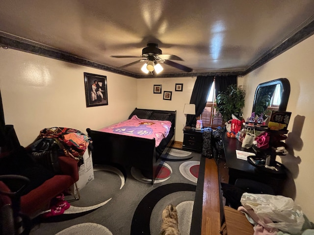 bedroom featuring ceiling fan and ornamental molding