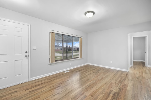 unfurnished room featuring light hardwood / wood-style floors