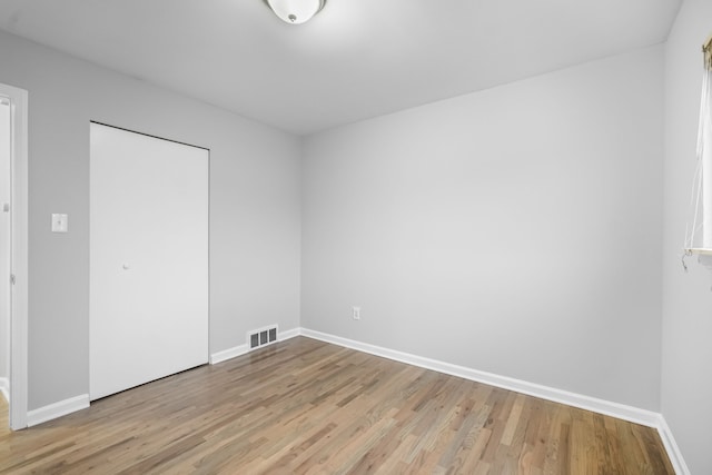 spare room with light hardwood / wood-style flooring