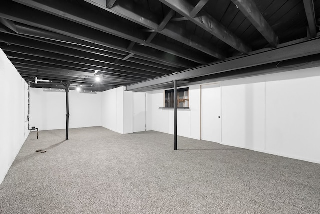 basement with carpet flooring