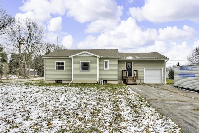 single story home with a garage