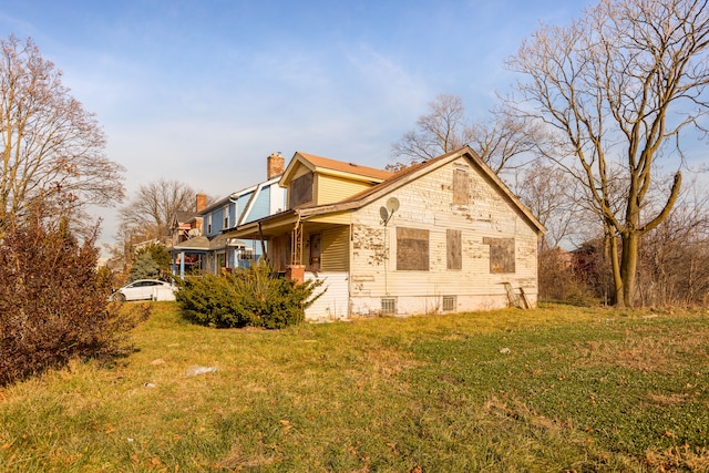 view of home's exterior featuring a lawn