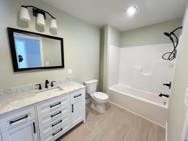 full bath with vanity, toilet, washtub / shower combination, and visible vents