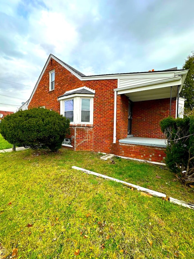 view of home's exterior featuring a lawn