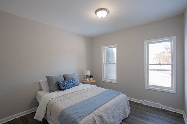 bedroom featuring dark wood-type flooring