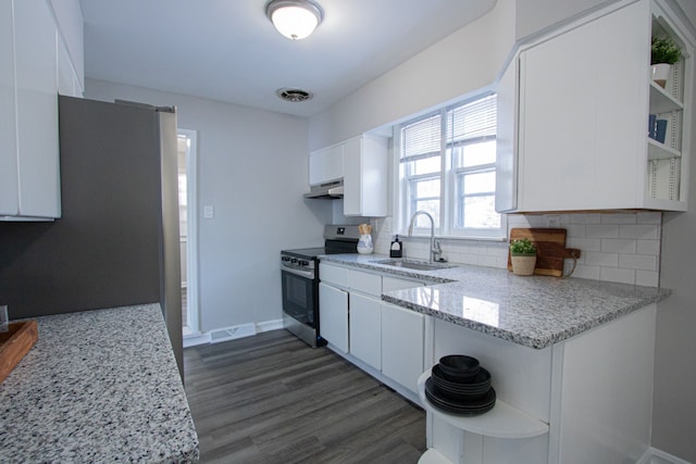 kitchen with light stone countertops, sink, stainless steel range with electric cooktop, decorative backsplash, and white cabinets