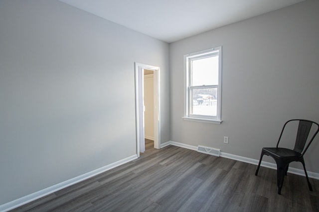 unfurnished room featuring dark hardwood / wood-style floors