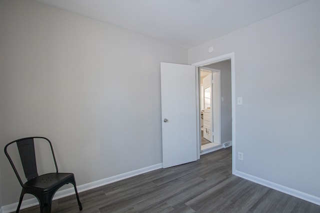 spare room with dark hardwood / wood-style flooring