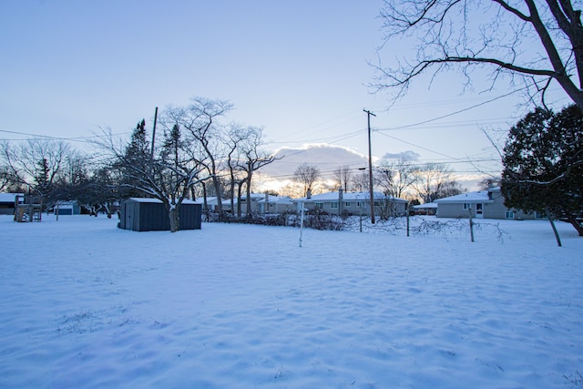 view of yard covered in snow