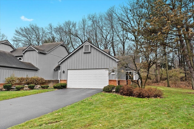 view of front of home with a garage and a front yard