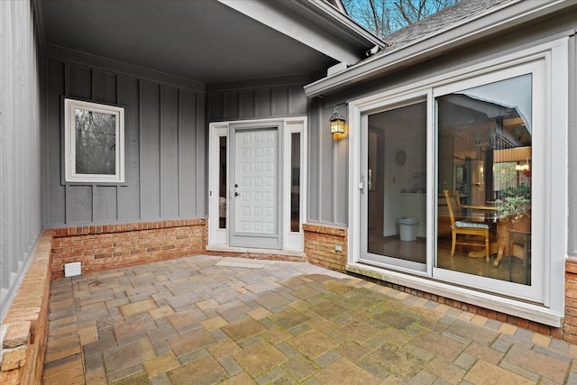 entrance to property featuring a patio