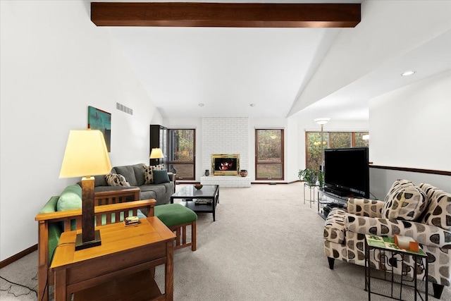 living room with beam ceiling, carpet floors, a fireplace, and high vaulted ceiling