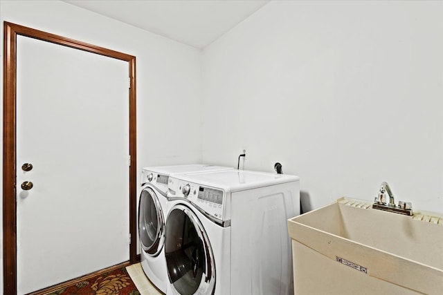 laundry area featuring washer and dryer and sink