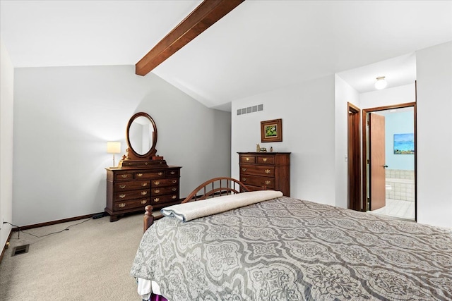 carpeted bedroom with vaulted ceiling with beams and ensuite bathroom