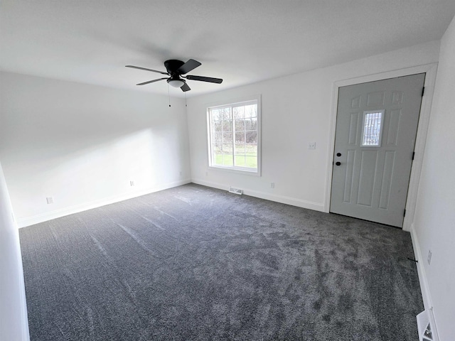 carpeted entrance foyer with ceiling fan