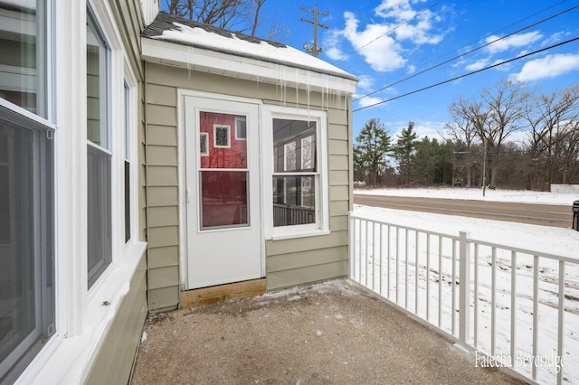 view of snow covered property entrance