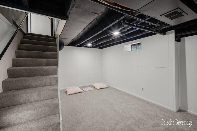 basement featuring carpet flooring