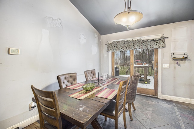 dining area with lofted ceiling