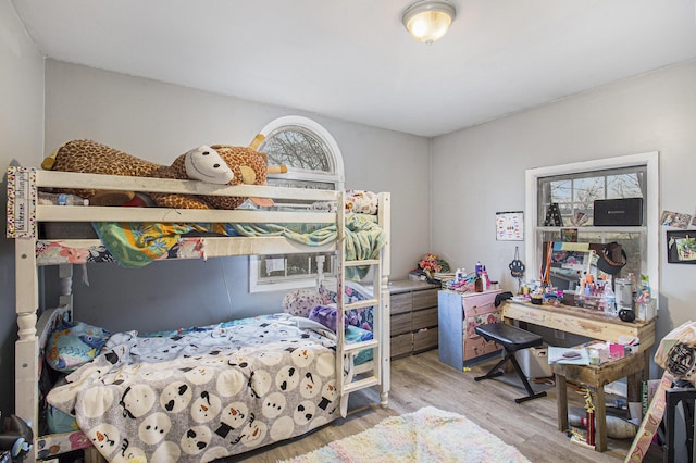 bedroom with hardwood / wood-style flooring