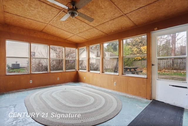 unfurnished sunroom with ceiling fan