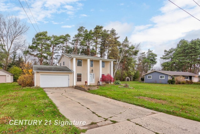 view of front of property with a garage and a front lawn