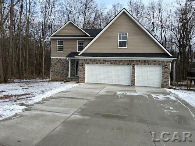 front of property with a garage