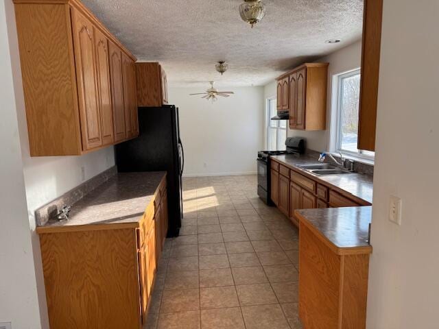 kitchen with black appliances, sink, ceiling fan, a textured ceiling, and light tile patterned flooring