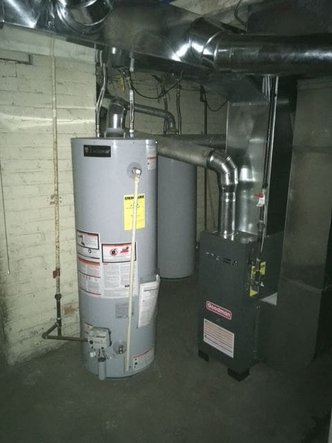 utility room with gas water heater