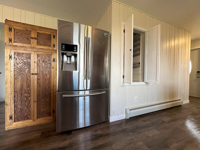 kitchen with stainless steel fridge with ice dispenser, dark hardwood / wood-style flooring, and a baseboard heating unit