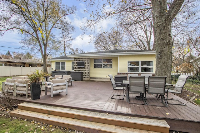 deck featuring outdoor lounge area