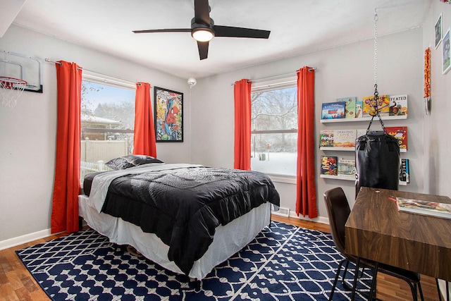 bedroom featuring hardwood / wood-style floors and ceiling fan