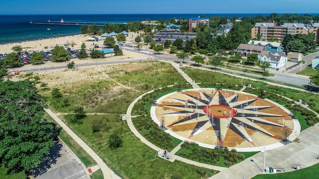 aerial view with a water view and a beach view