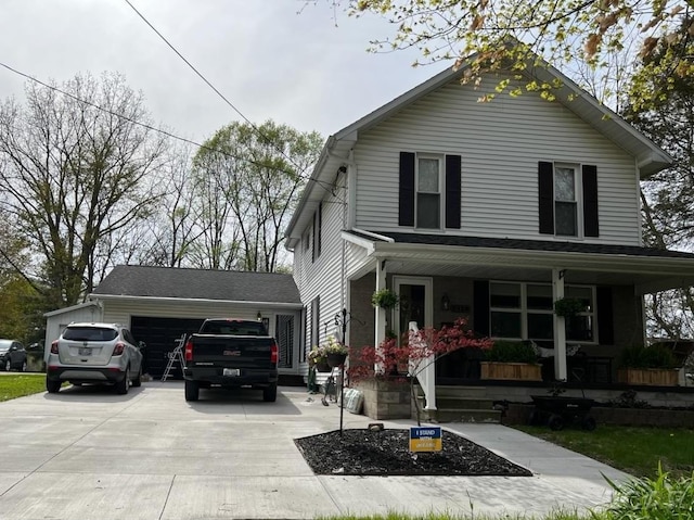 front facade with covered porch and a garage