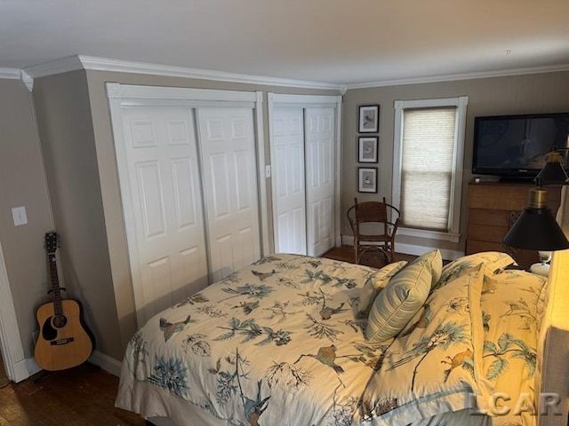 bedroom featuring dark hardwood / wood-style flooring and ornamental molding