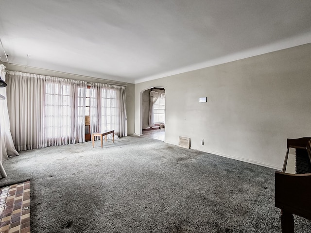 unfurnished living room with carpet