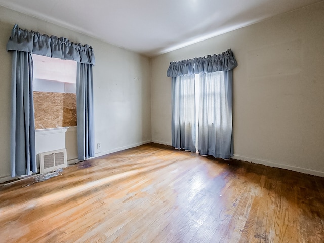 empty room with wood-type flooring