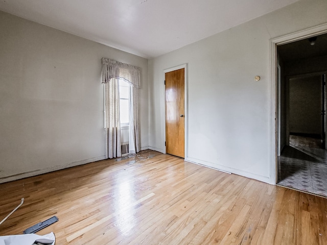 spare room featuring light hardwood / wood-style flooring