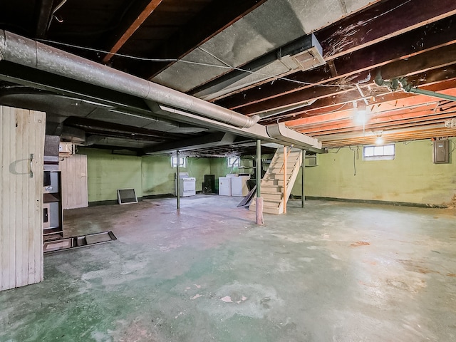 basement with independent washer and dryer and electric panel