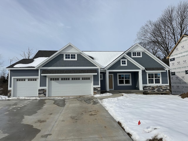 craftsman-style home featuring a garage