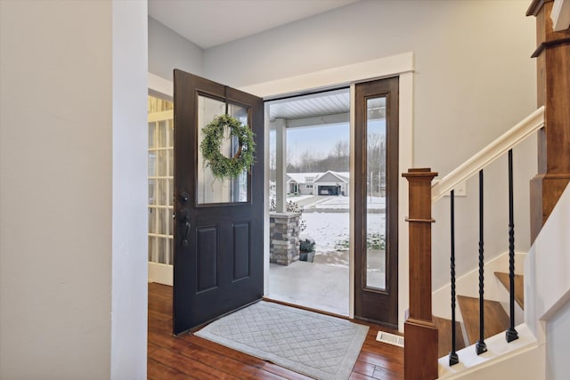 entrance foyer featuring dark hardwood / wood-style flooring