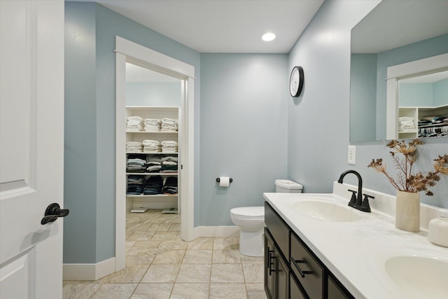 bathroom featuring vanity and toilet