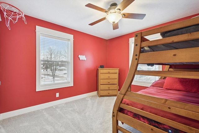 bedroom featuring ceiling fan and light colored carpet