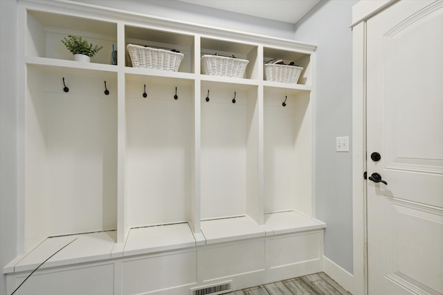 mudroom with light hardwood / wood-style flooring