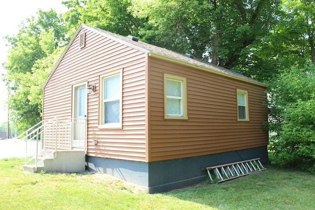 view of home's exterior featuring a lawn