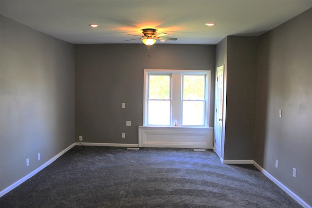 carpeted empty room featuring ceiling fan