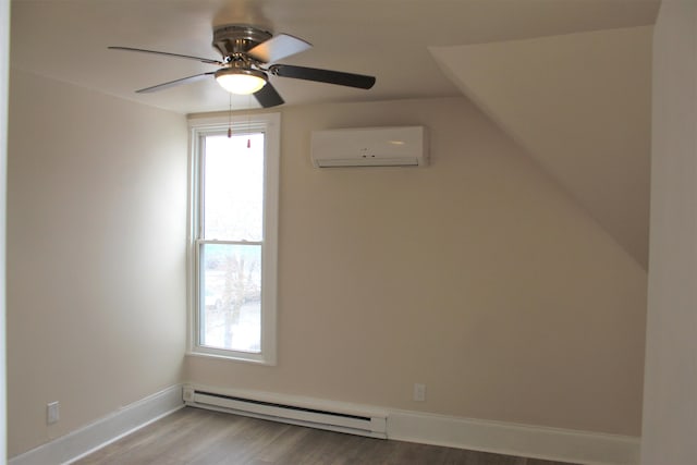 interior space with baseboard heating, ceiling fan, light hardwood / wood-style flooring, and a wall unit AC