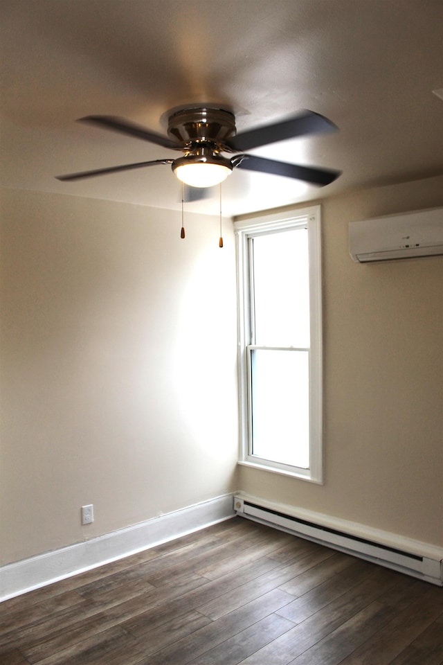 unfurnished room featuring plenty of natural light, dark hardwood / wood-style floors, a wall mounted AC, and a baseboard radiator