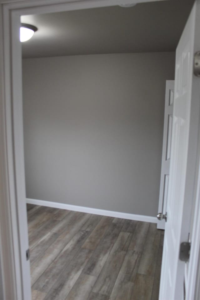 unfurnished room featuring hardwood / wood-style flooring