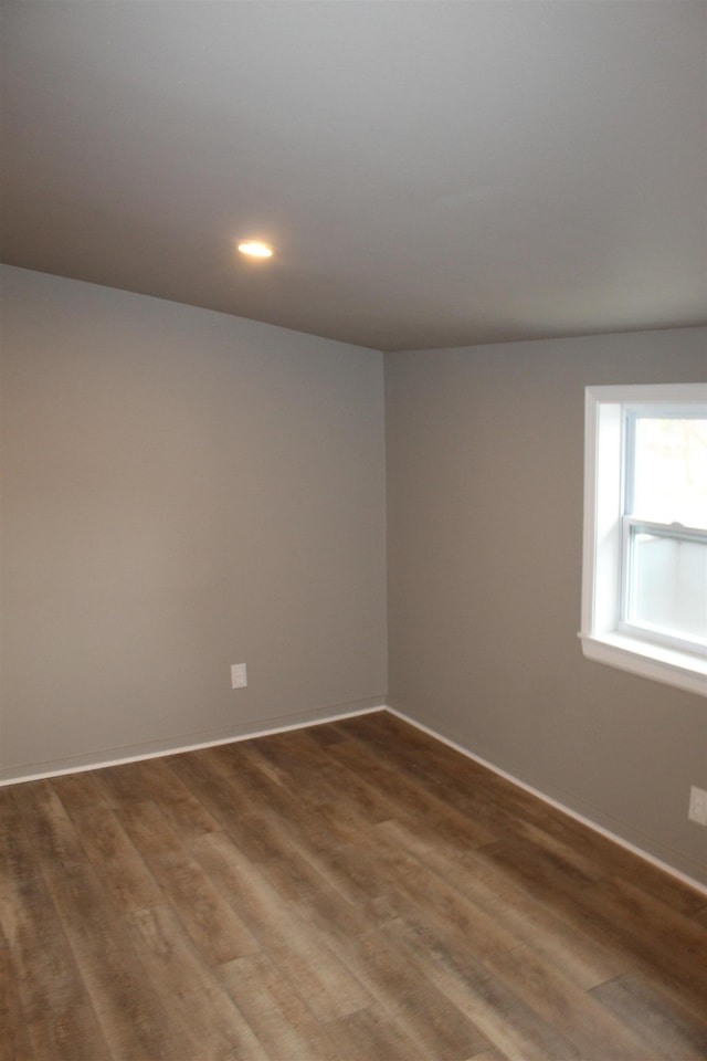 spare room featuring dark hardwood / wood-style floors