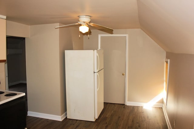 kitchen featuring dark hardwood / wood-style flooring, white appliances, vaulted ceiling, and ceiling fan